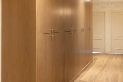massive hallway wardrobe. double hang on left, full deep shelving on right with pullouts. flat front grain match oak