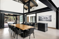 Hackberry top with black patina’s custom steel base. Dining island with UC refrigerators